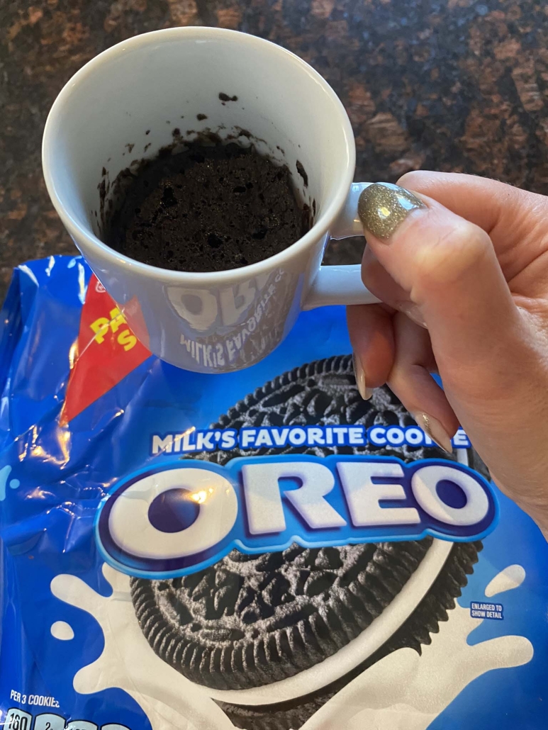 Oreo mug cake next to pack of Oreo cookies