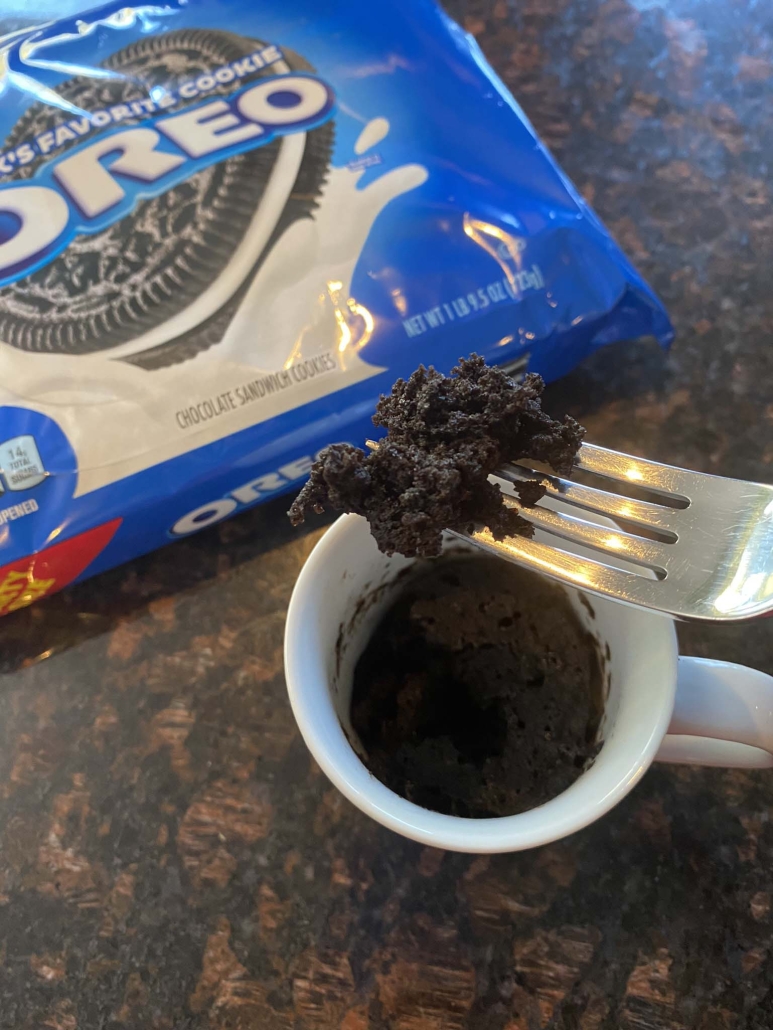 Oreo mug cake next to a package of Oreos