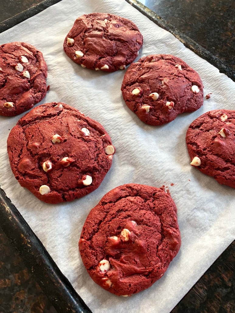 red velvet cookies on a cookie sheet