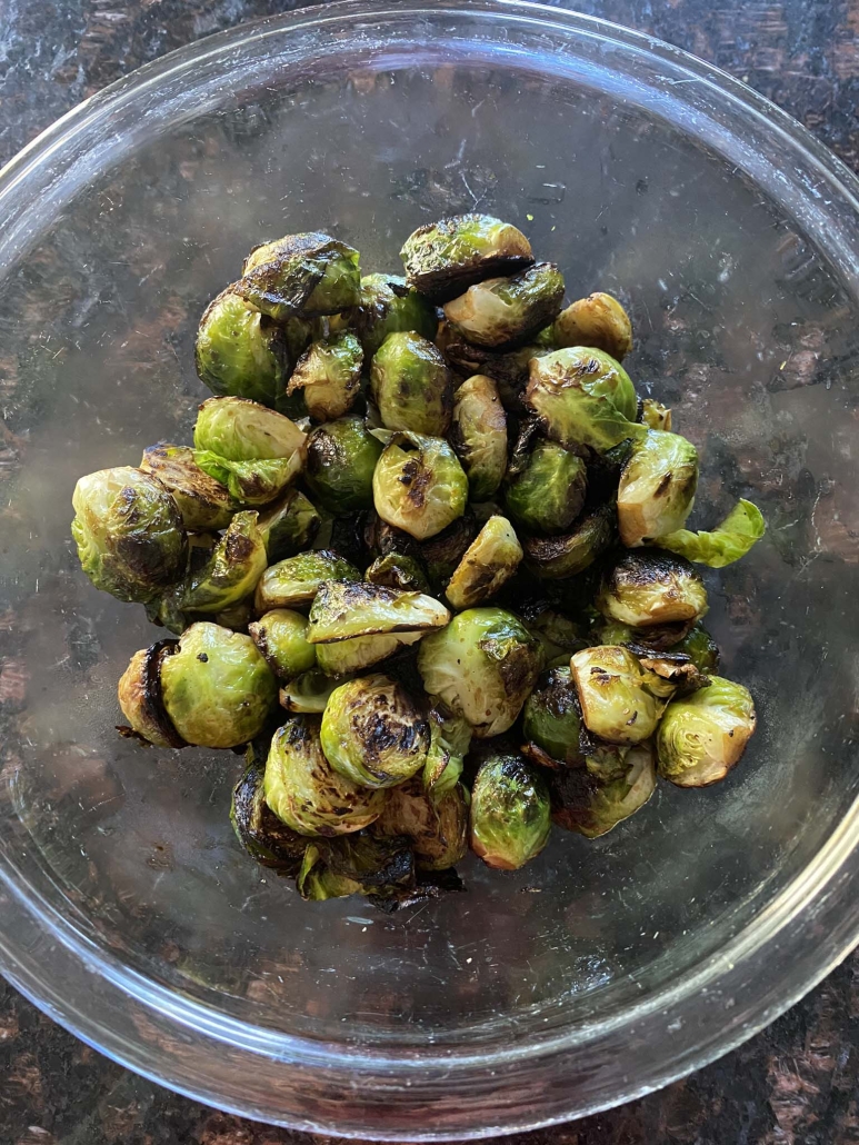 bowl of cooked, seasoned Brussels sprouts