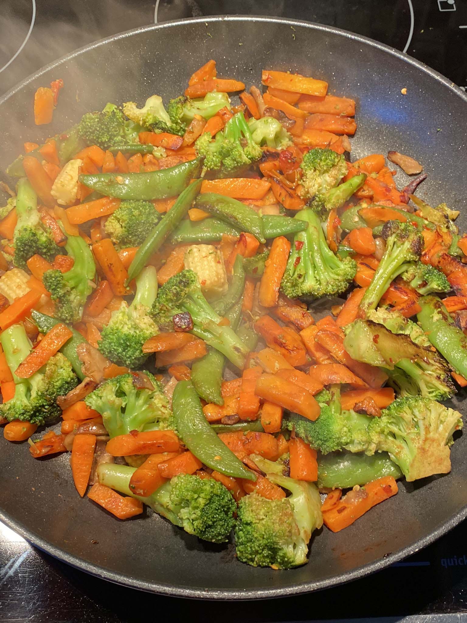 Sauteed vegetables in a frying pan.