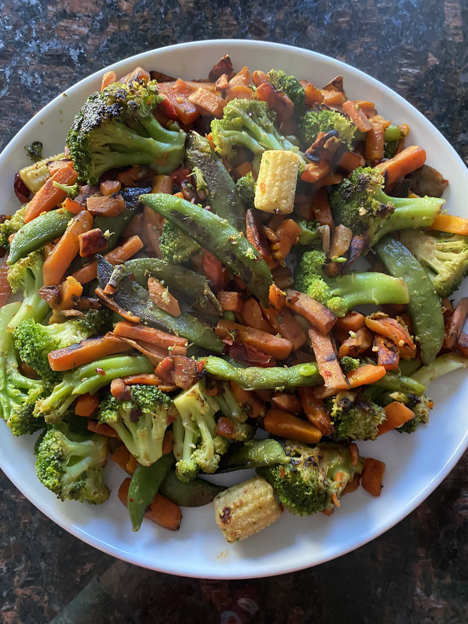 Sauteed vegetables on a plate.