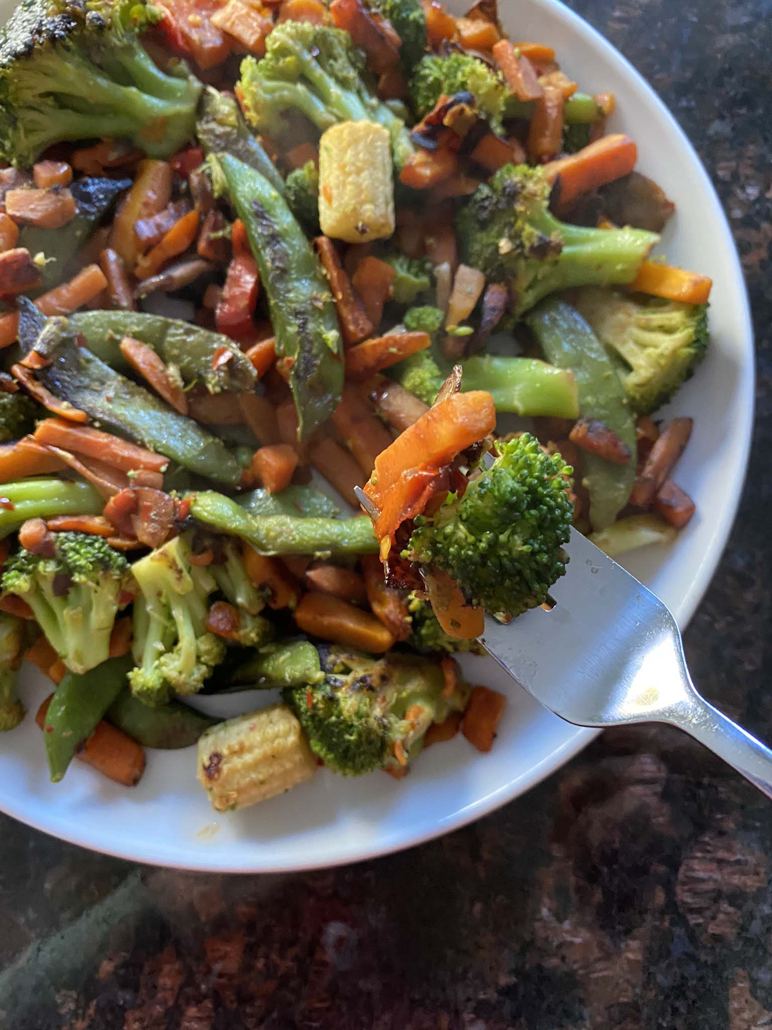 Sauteed vegetables on a plate.