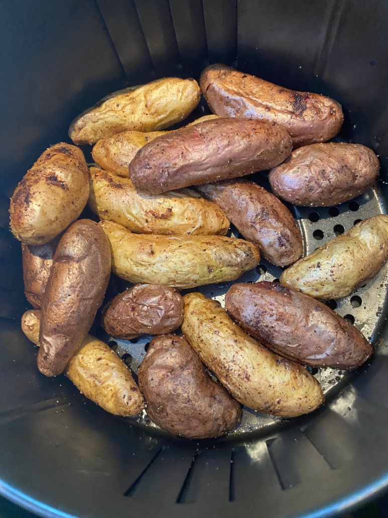 close-up of seasoned potatoes in air fryer