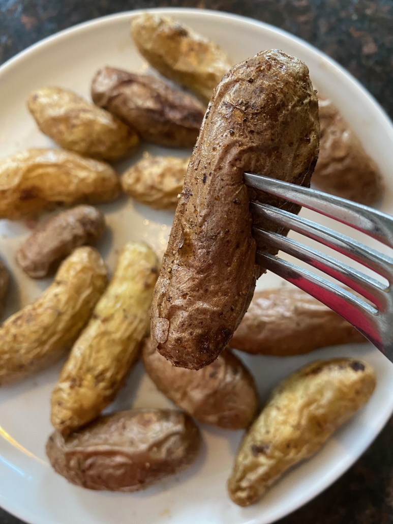 fork holding piece of fingerling potato