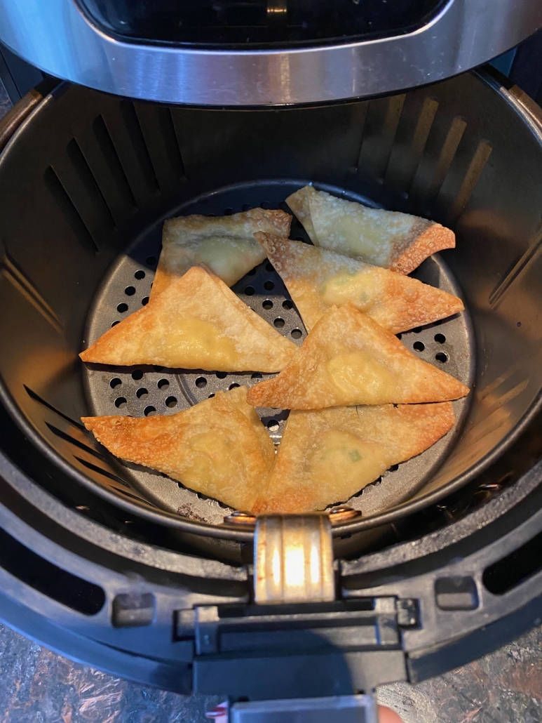 cooked crab rangoon in air fryer basket