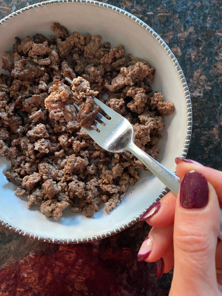 air fryer ground beef in a bowl with fork