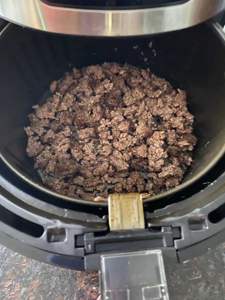 ground beef being cooked in air fryer