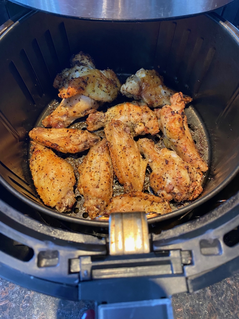 lemon pepper chicken wings in air fryer basket