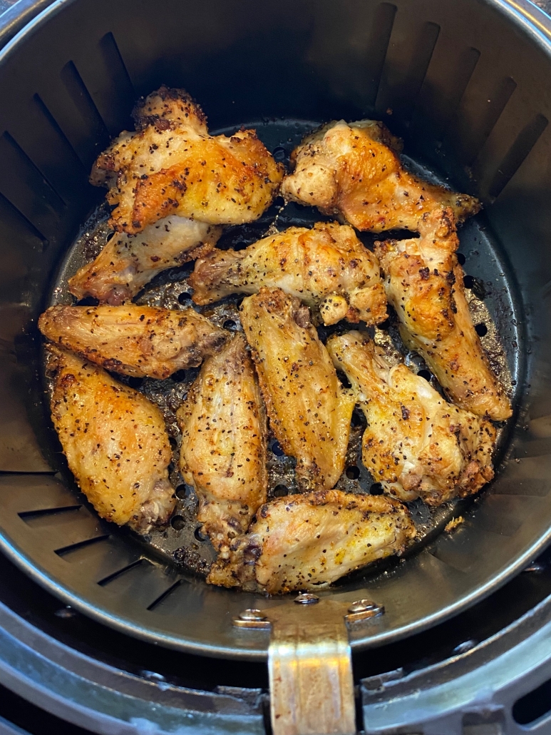 lemon pepper chicken wings in air fryer basket