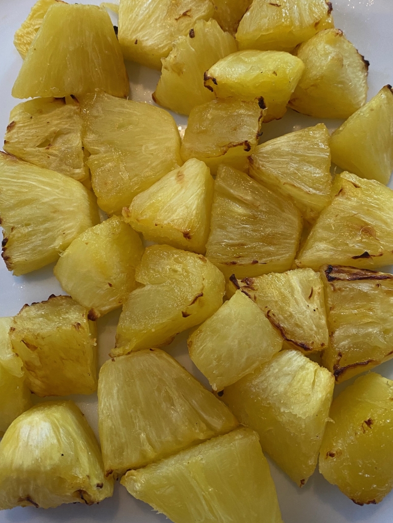 closer-up of fork holding piece of air fryer pineapple