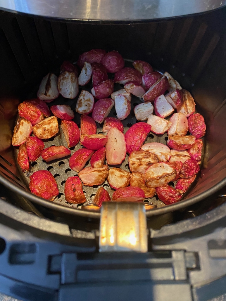 roasted, seasoned radishes in air fryer basket