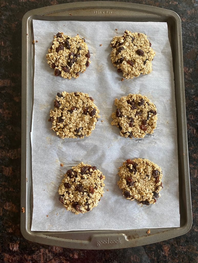 applesauce oatmeal raisin cookies on baking sheet