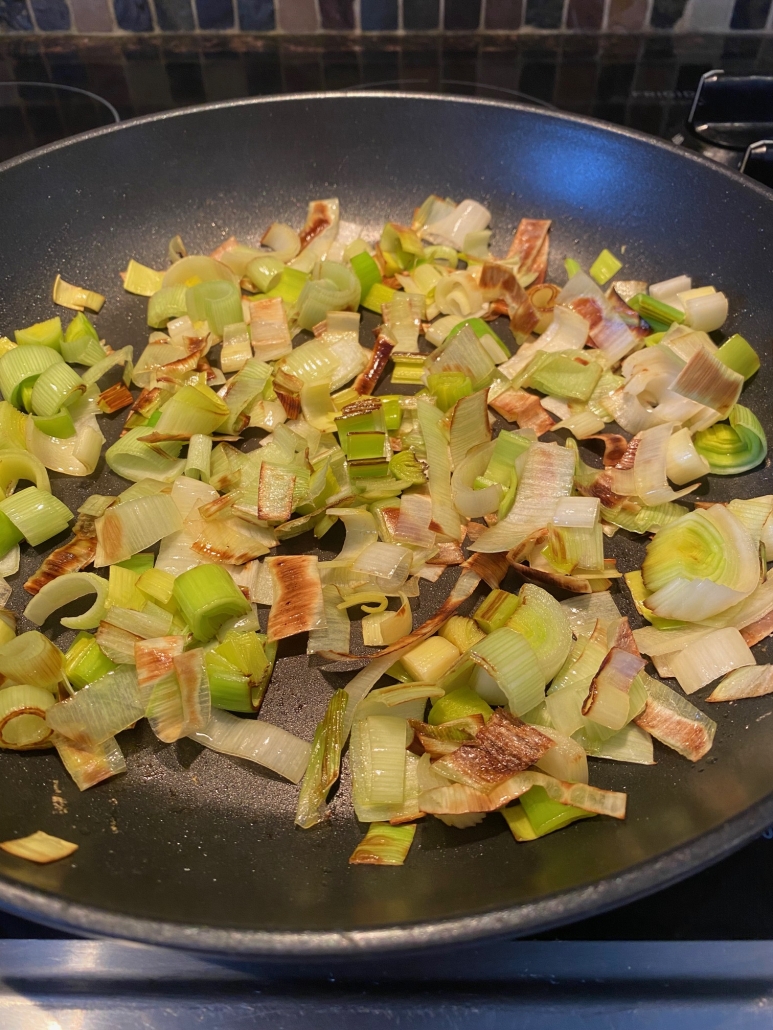 sautéed leeks in a skillet