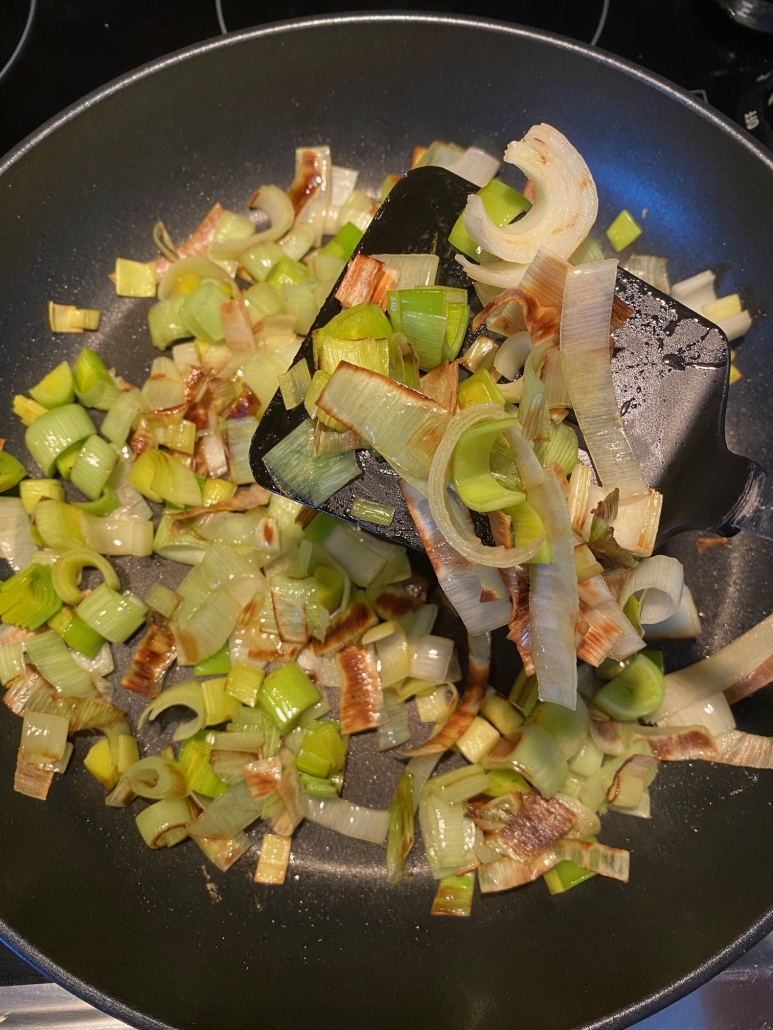 sautéed leeks with spatula