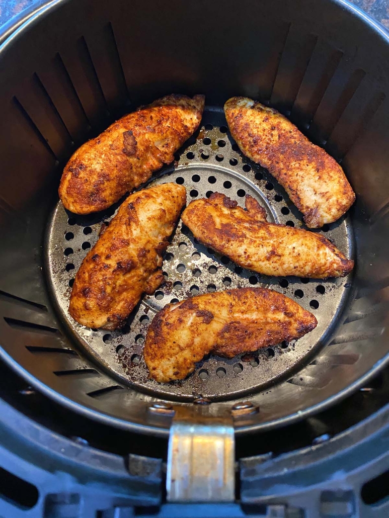 seasoned chicken tenders in air fryer basket