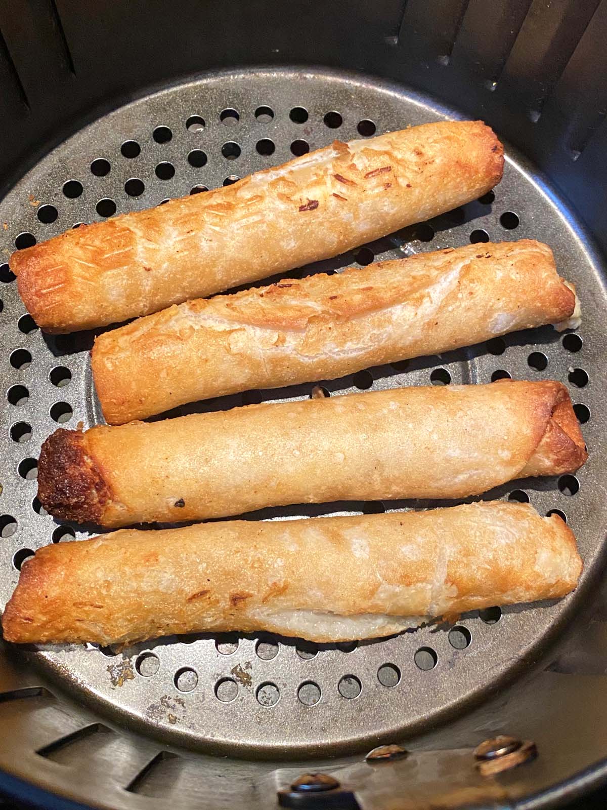 Cooked flautas in an air fryer. 