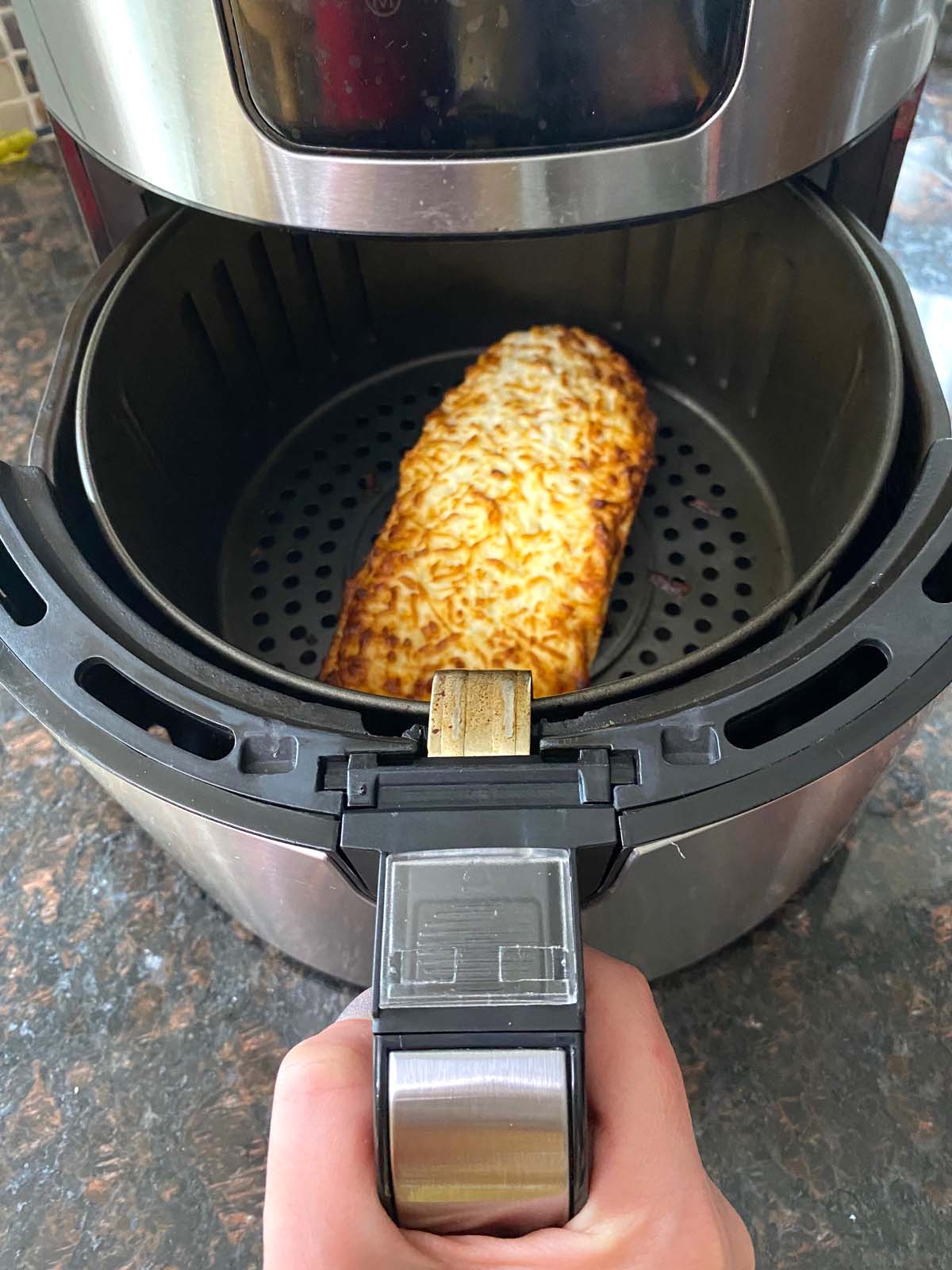 Cooked French bread pizza in an air fryer. 