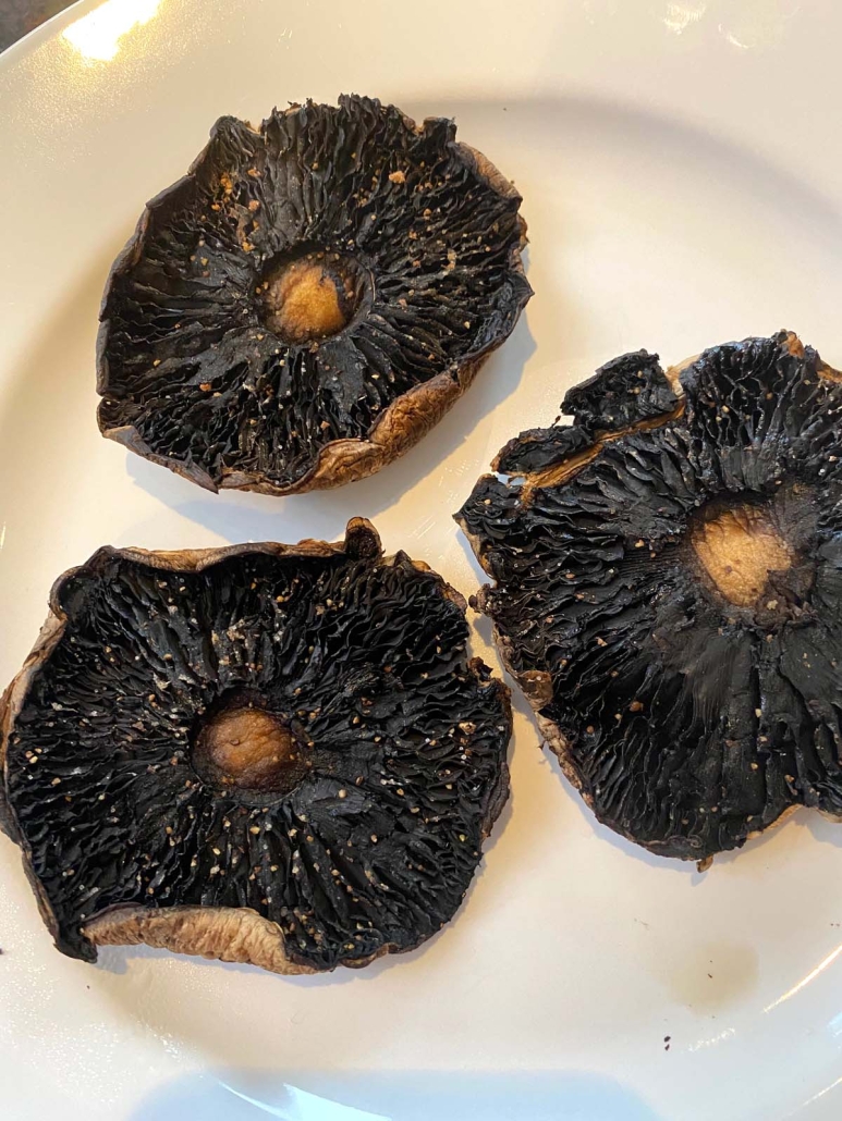 cooked portobello mushrooms on a plate