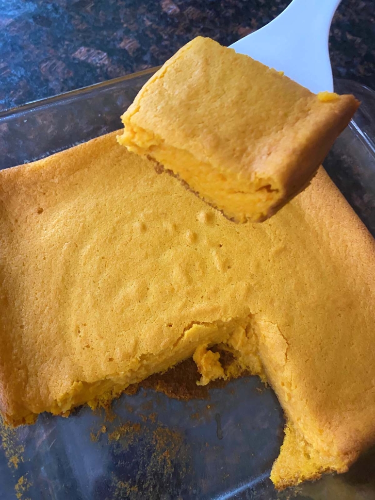 spatula holding piece of baked carrot soufflé