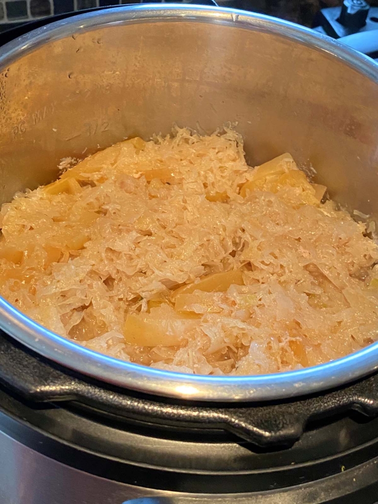 Instant Pot Pork And Sauerkraut seasoned and cooked