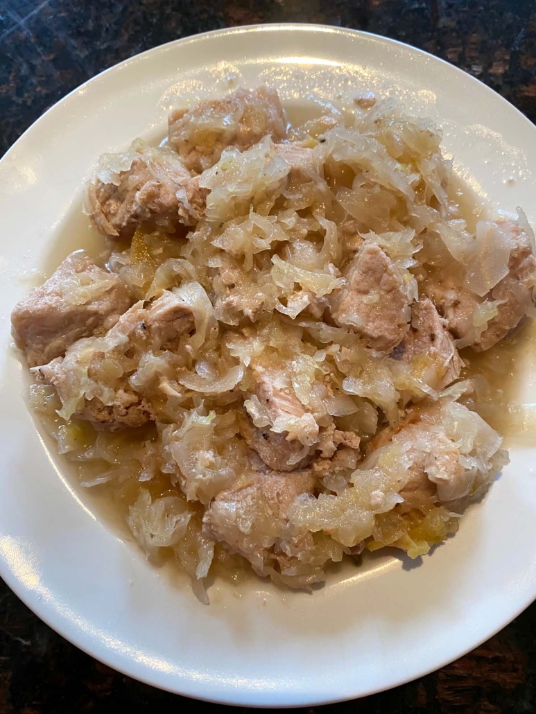serving dish of pork with sauerkraut