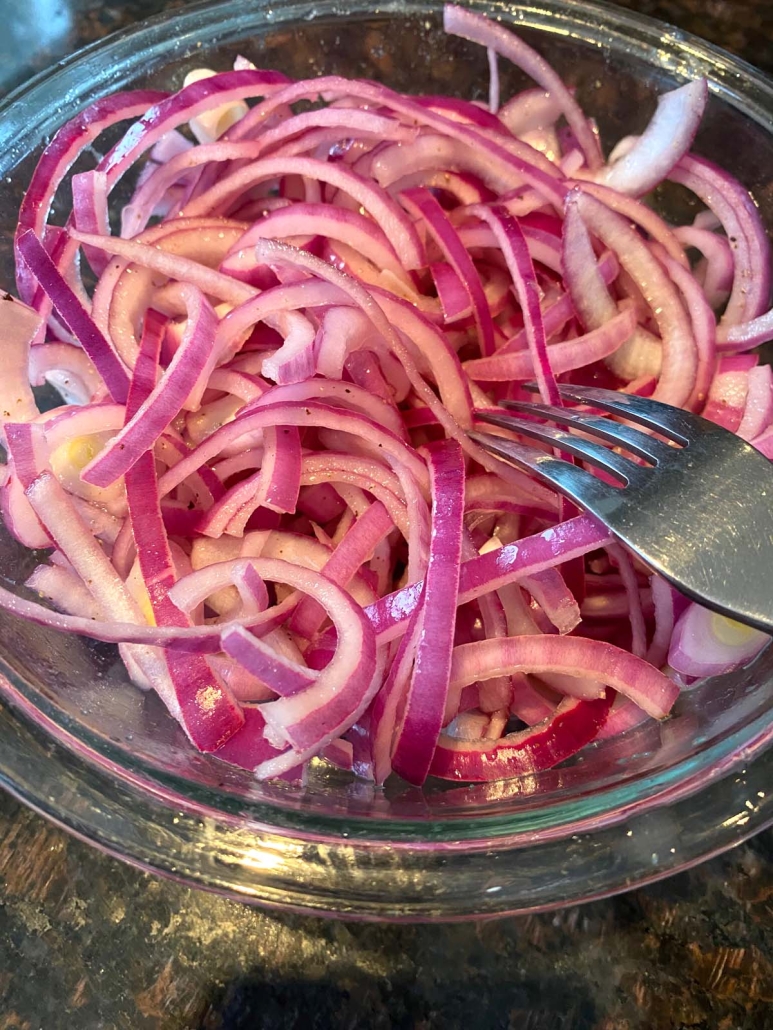 fork in bowl of Mexican Pickled Red Onions