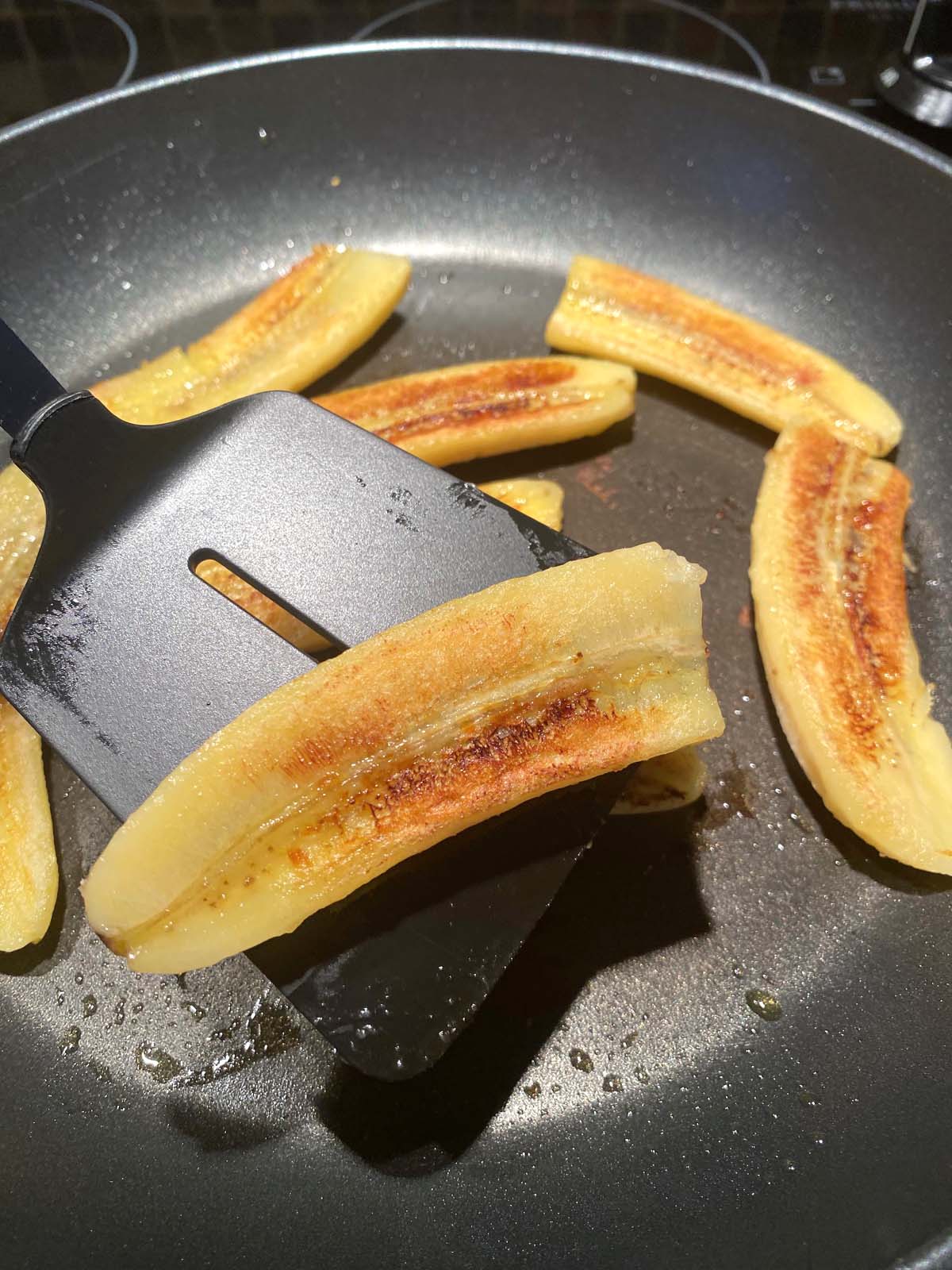 Fried bananas in a frying pan.