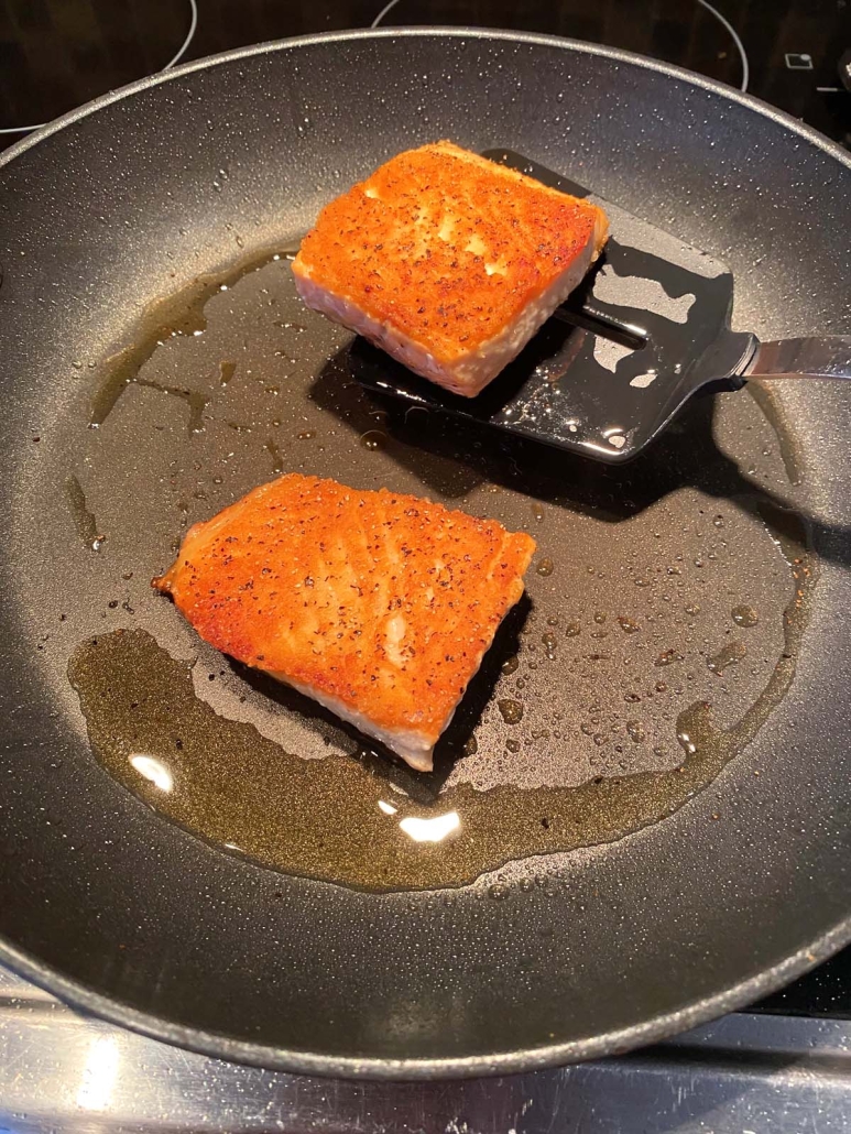 spatula flipping salmon fillet