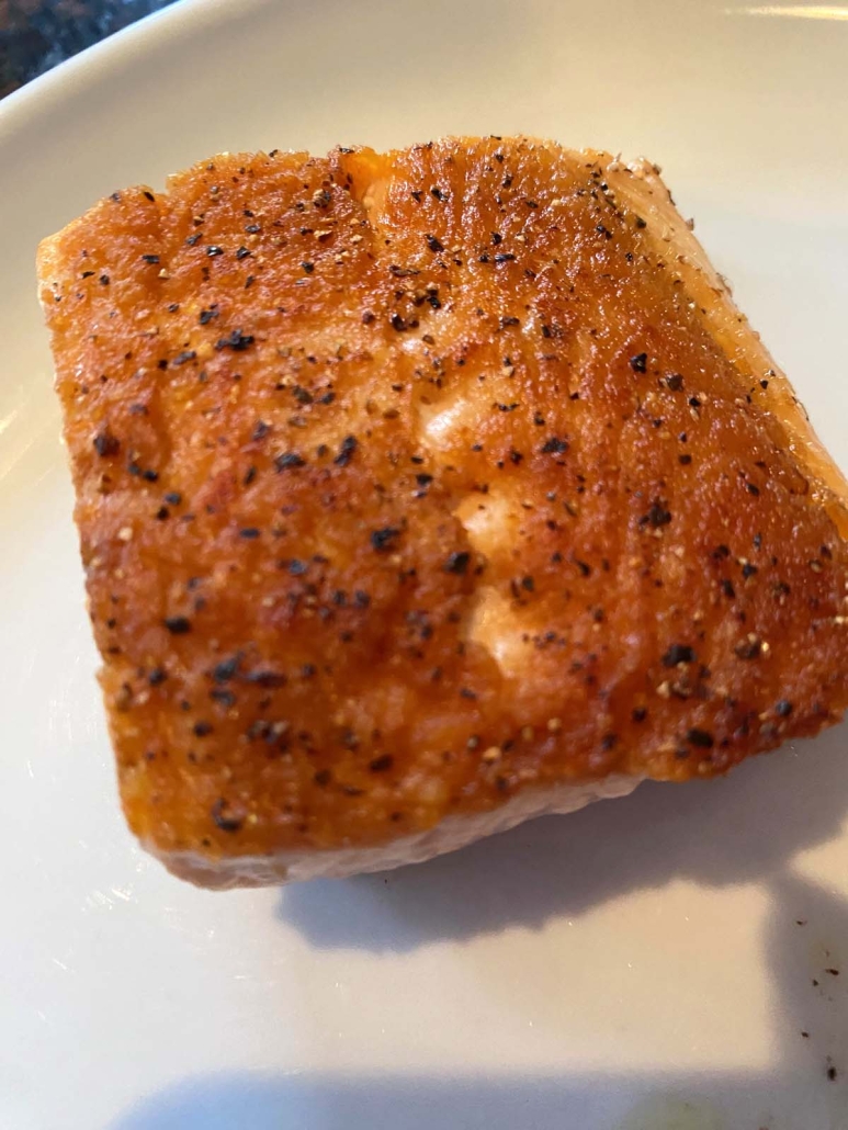 delicious Pan Fried Salmon with a golden brown crust
