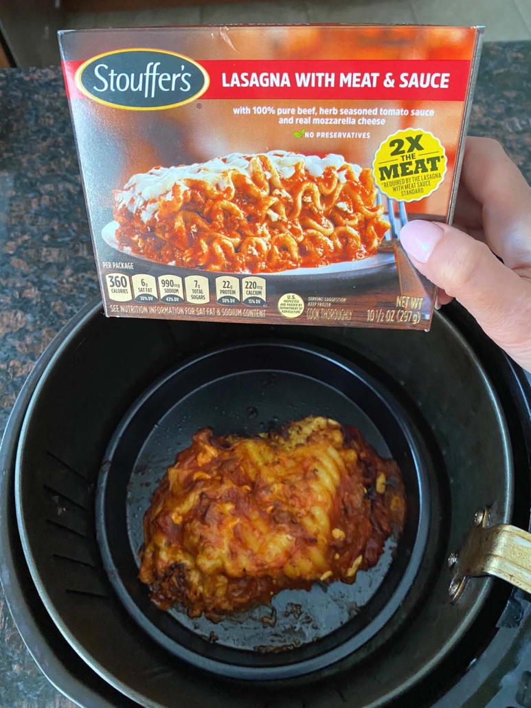 package of Stouffer's lasagna next to air fryer basket with lasagna inside