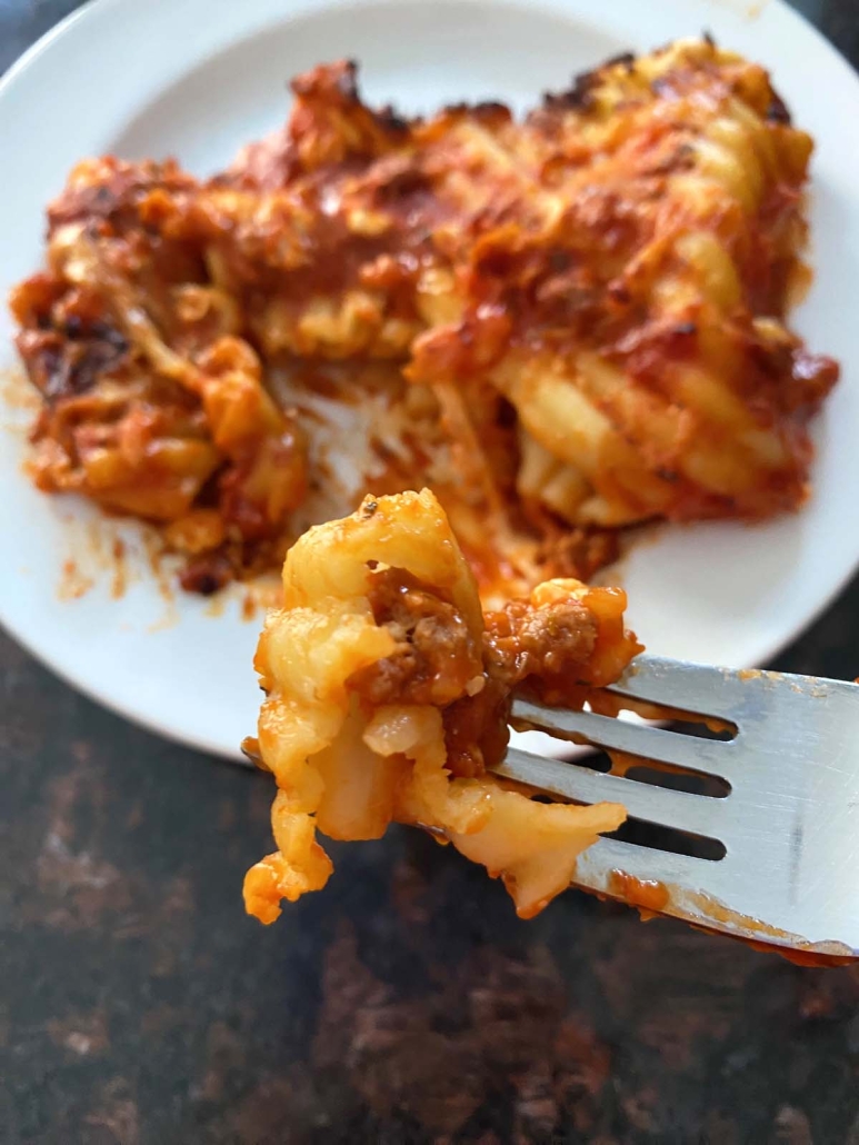 fork holding piece of Stouffer's Lasagna