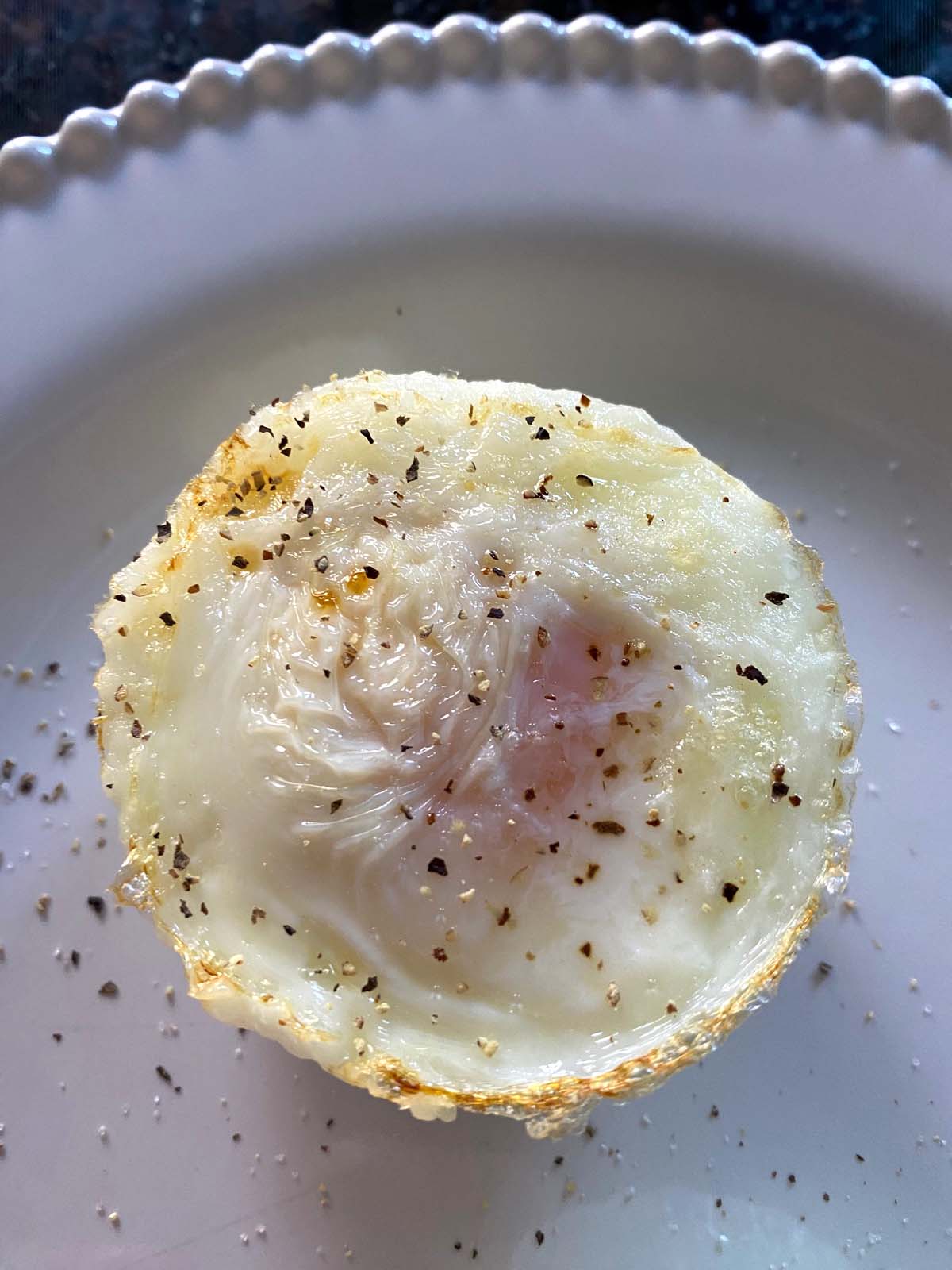 https://www.melaniecooks.com/wp-content/uploads/2023/02/Air-Fryer-Poached-Eggs-5.jpg