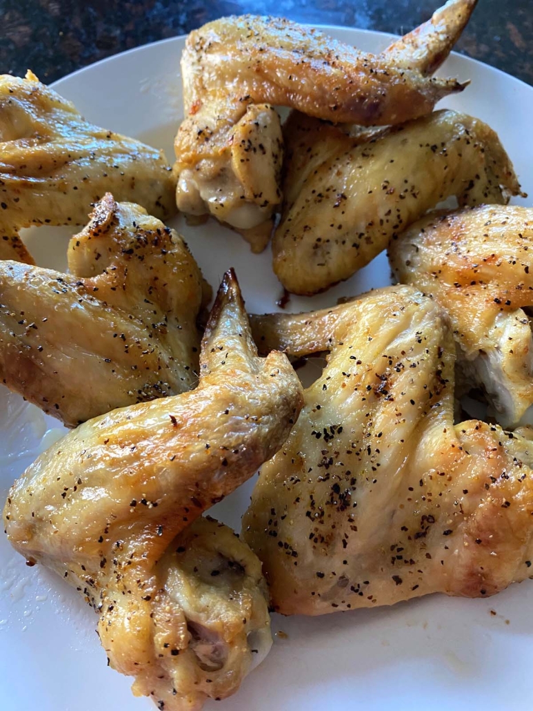 plate of golden brown Baked Lemon Pepper Wings