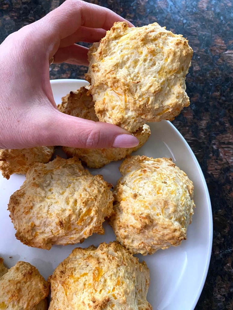 hand holding Bisquick Cheddar Biscuit