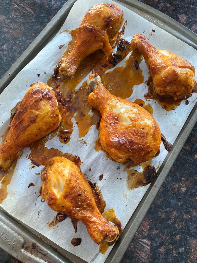 buffalo sauce topped chicken drumsticks