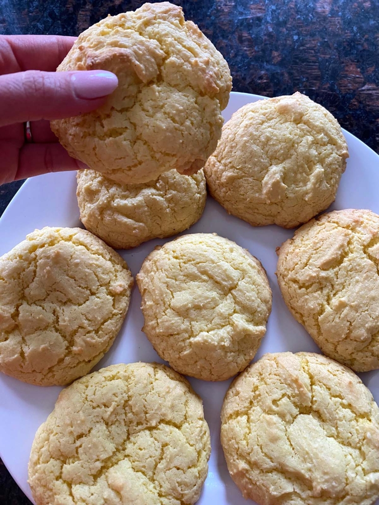 hand holding lemon cookie made with lemon cake mix