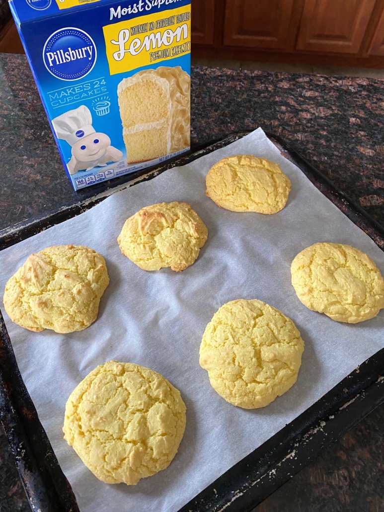 baking sheet of Lemon Cake Mix Cookies in front of box of cake mix