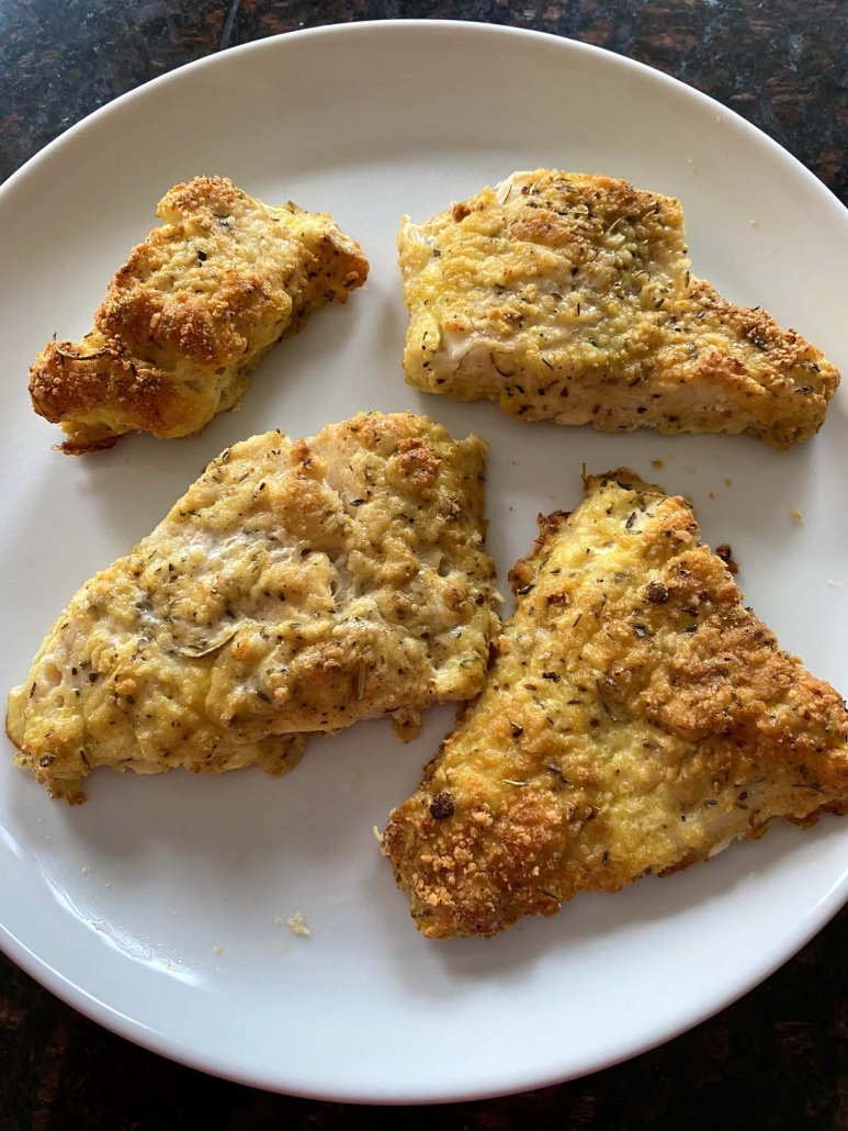 Parmesan Crusted Cod Fish fillets on a plate