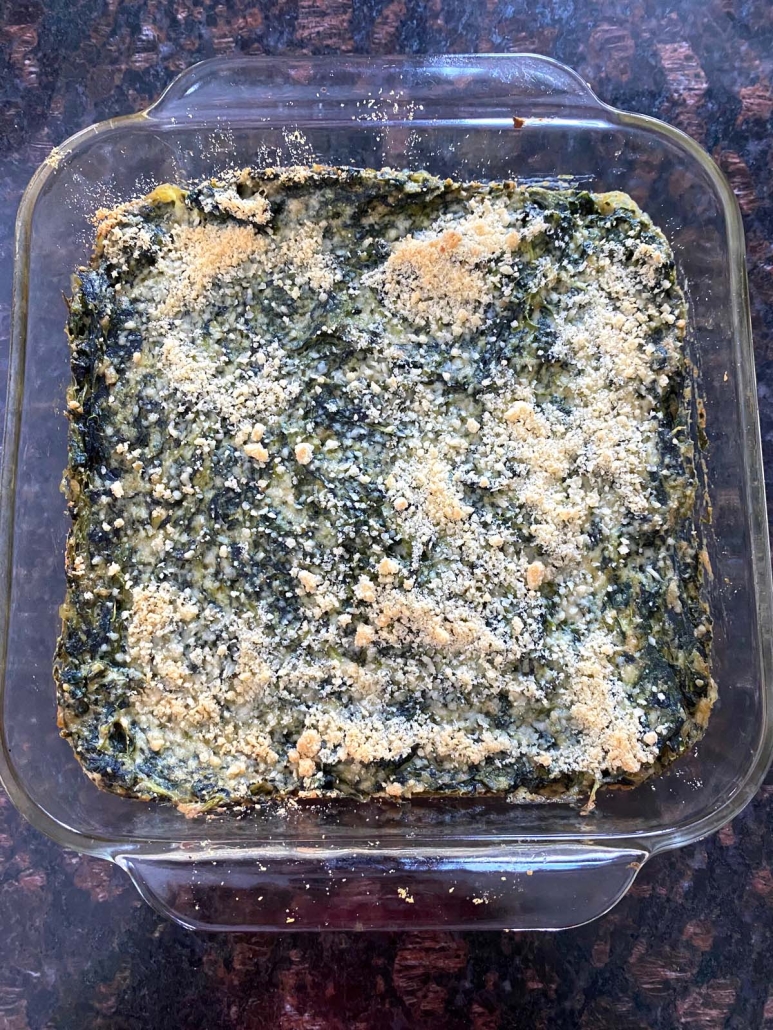 Spinach Casserole topped with parmesan cheese