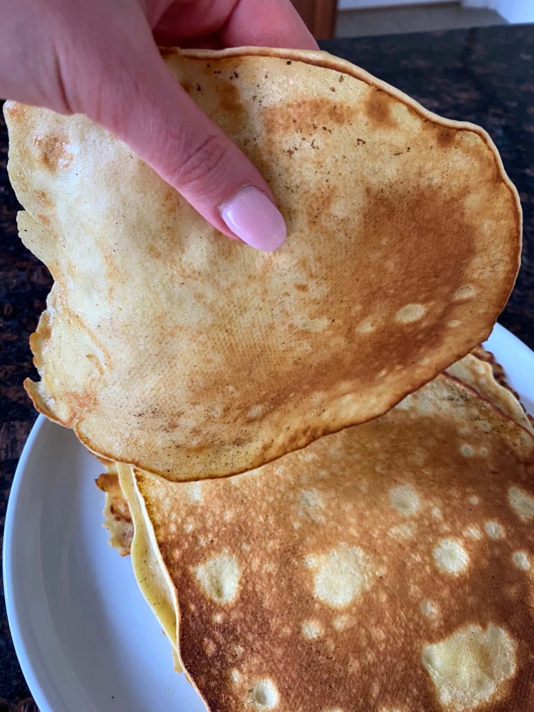 hand holding cooked Swedish Pancake