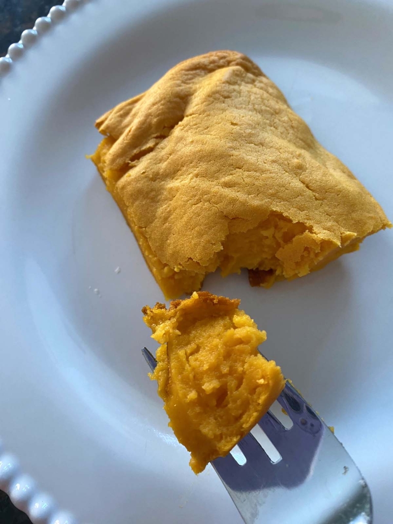 fork holding piece of Sweet Potato Souffle
