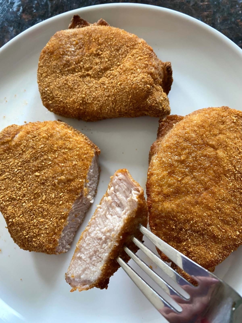 fork holding piece of Shake N Bake pork chops