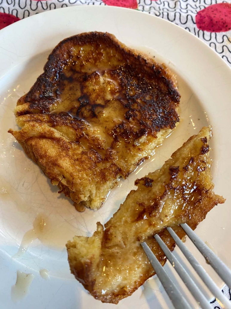 fork holding piece of brioche french toast