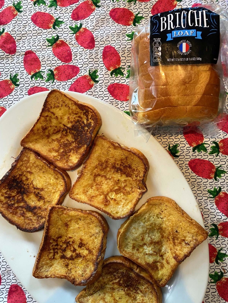 loaf of brioche bread next to Brioche French Toast