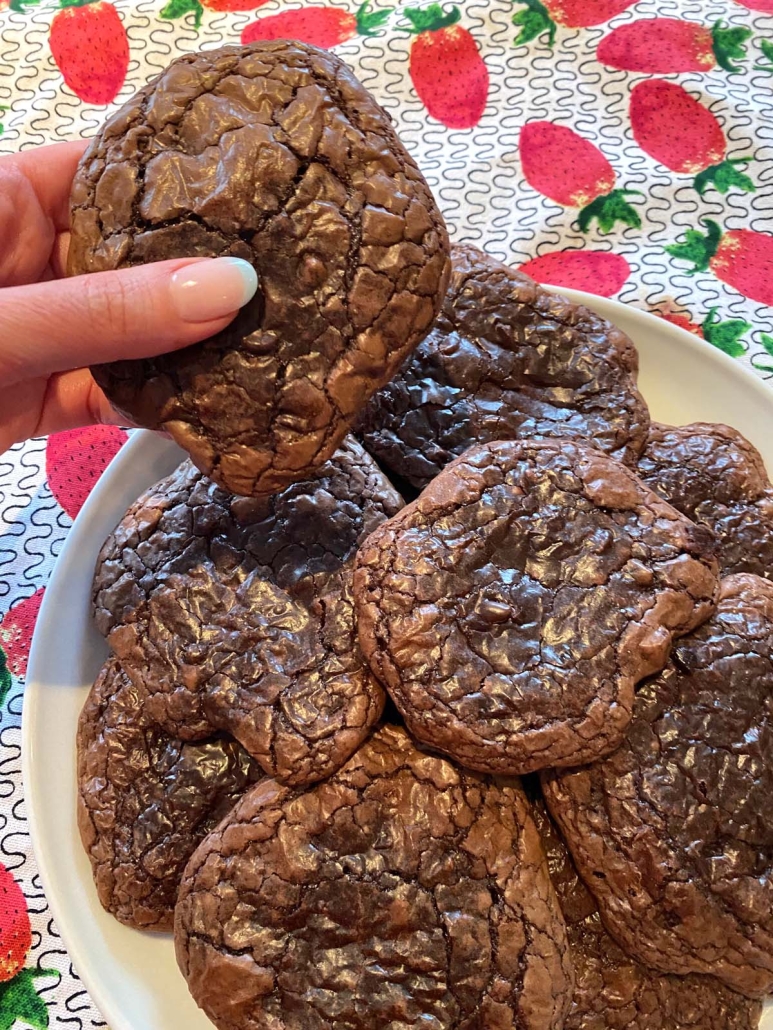 hand holding freshly baked Brownie Mix Cookie