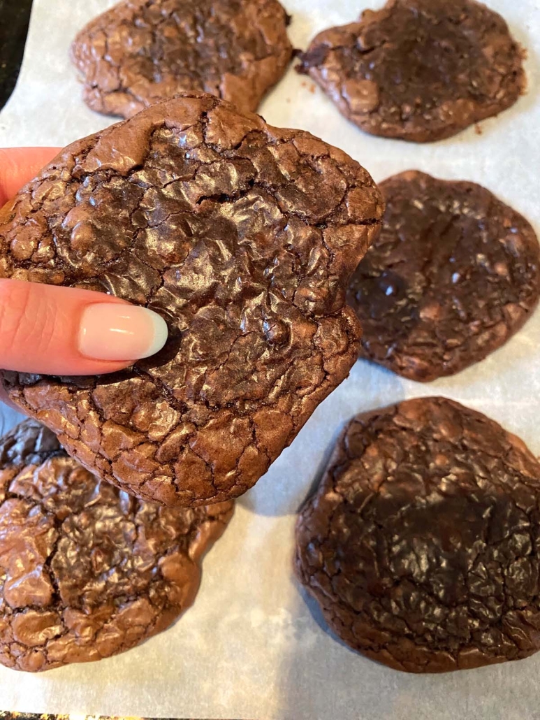 hand holding cookie made with brownie mix