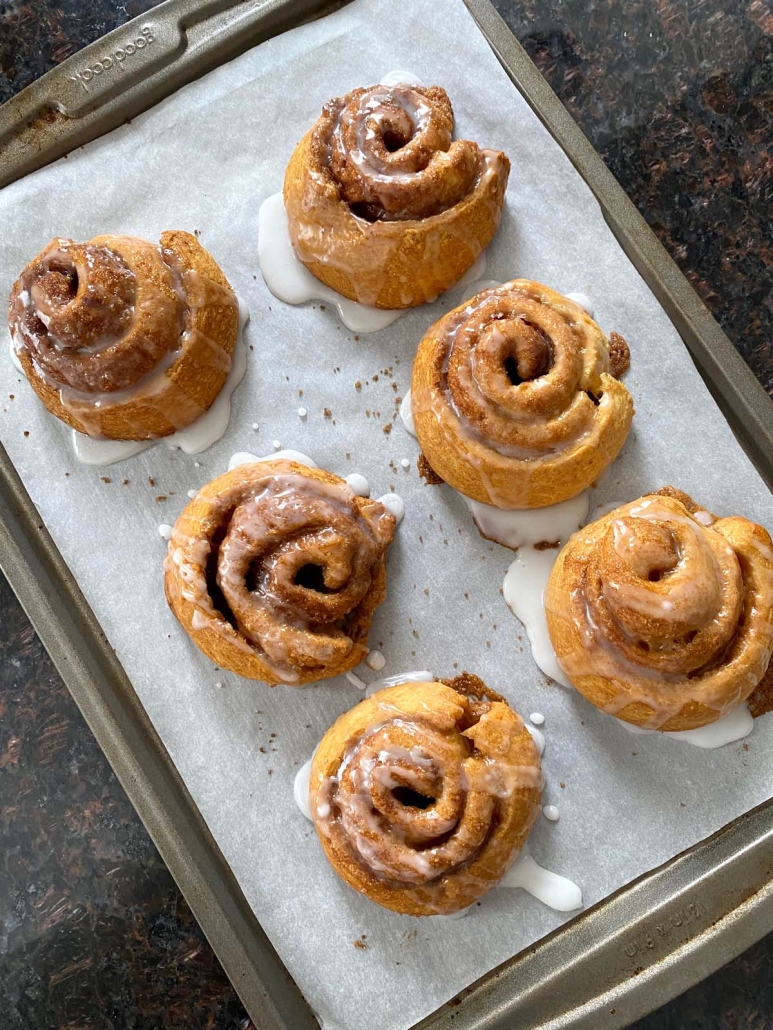 oven baked Crescent Roll Cinnamon Rolls on a tray