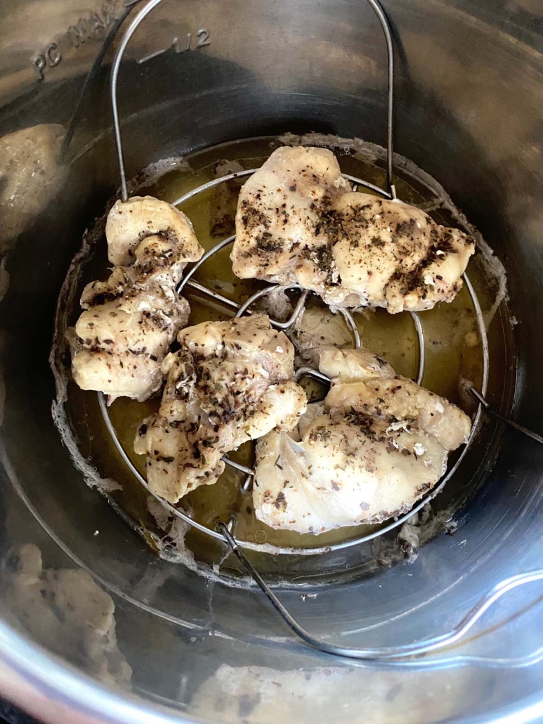 close-up of frozen chicken thighs in instant pot