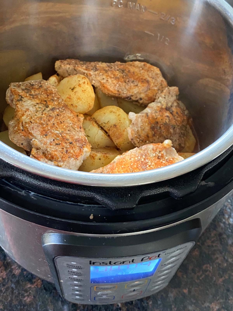 seasoned Pork Chops And Potatoes cooked in the Instant Pot